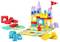 Ein buntes Baustein-Spielzeugset mit einem Schloss, Tierfiguren und einem Spielbrett mit farbigen Feldern und einem Drehpfeil.