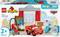LEGO Duplo Set 'McQueen's Besuch in Docs Garage' mit Lightning McQueen, Garage und anderem Zubehör, geeignet für Kinder ab 2 Jahren.