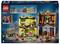 'LEGO-Set mit Zauberer-Thema: Zwei bunte Gebäude mit Zubehör und Figuren in einem städtischen Umfeld bei Nacht.'