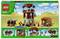 Minecraft-Lego-Set in Wüstenlandschaft mit Turm, Schweinen und Charakteren. Oberer Text: 'LEGO 21278'. 