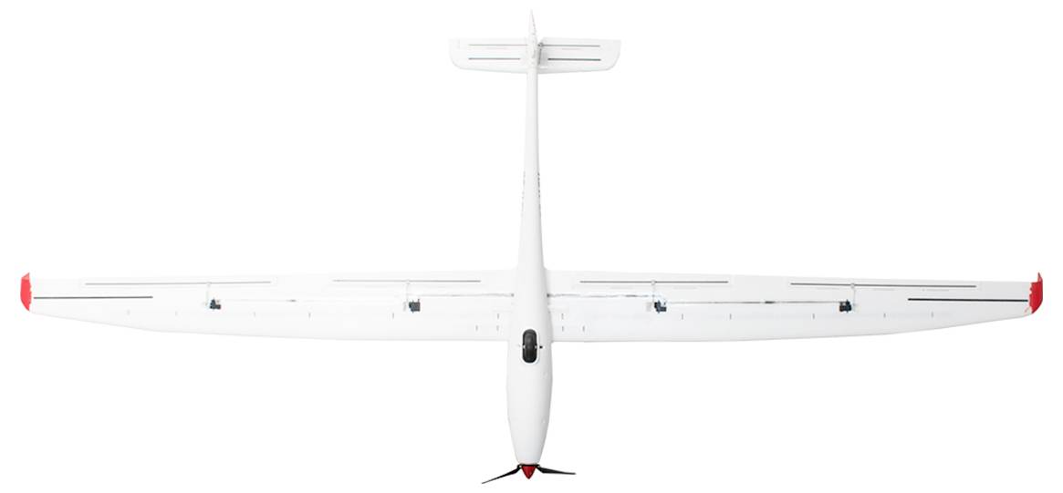 Ein weißes Flugzeug von oben gesehen, mit roten Markierungen an den Flügelspitzen.