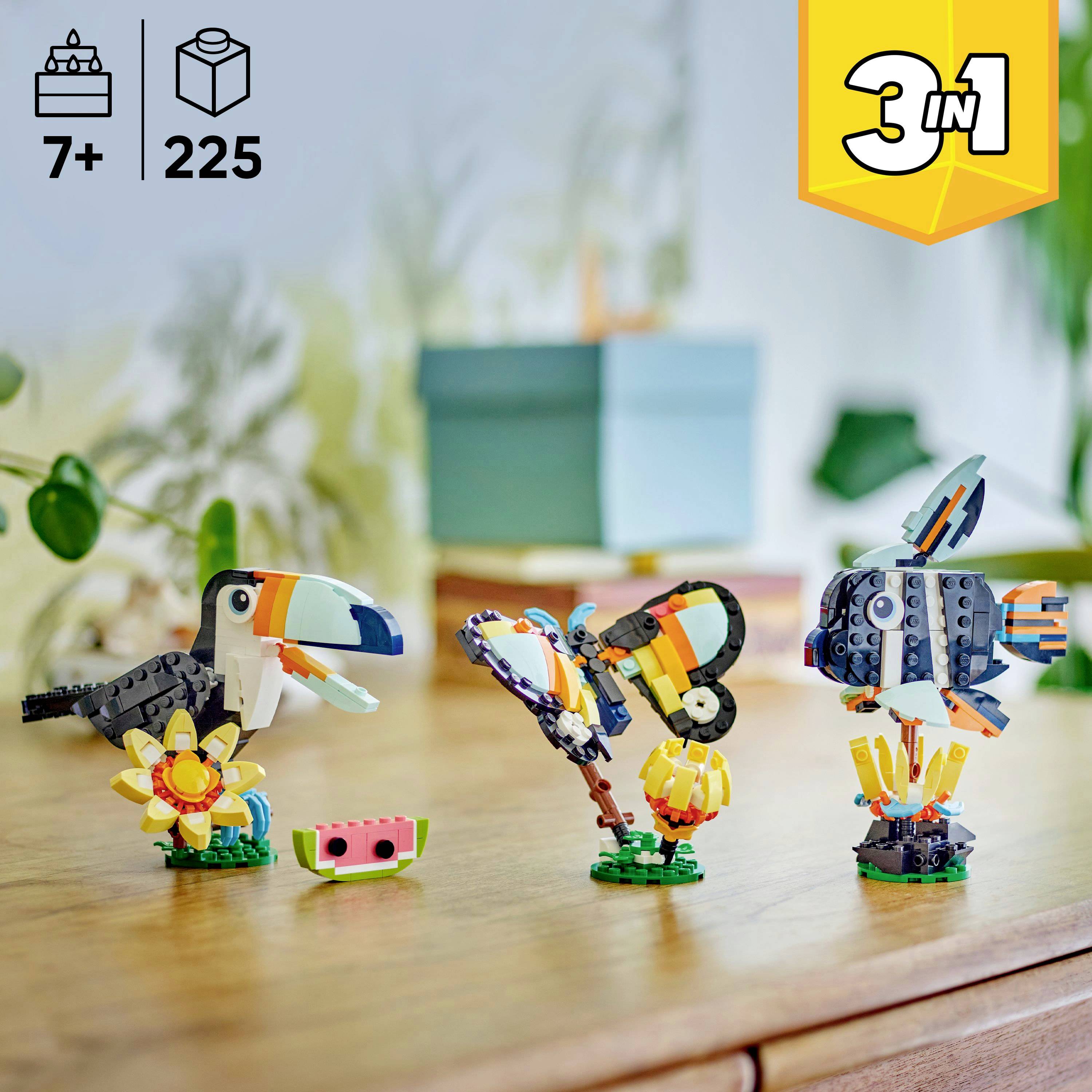 Lego-Set mit 225 Teilen, geeignet für Kinder ab 7 Jahren. Enthält farbenfrohe Modelle, darunter einen Tukan, einen Schmetterling und einen Fisch. ‚3 in 1'.