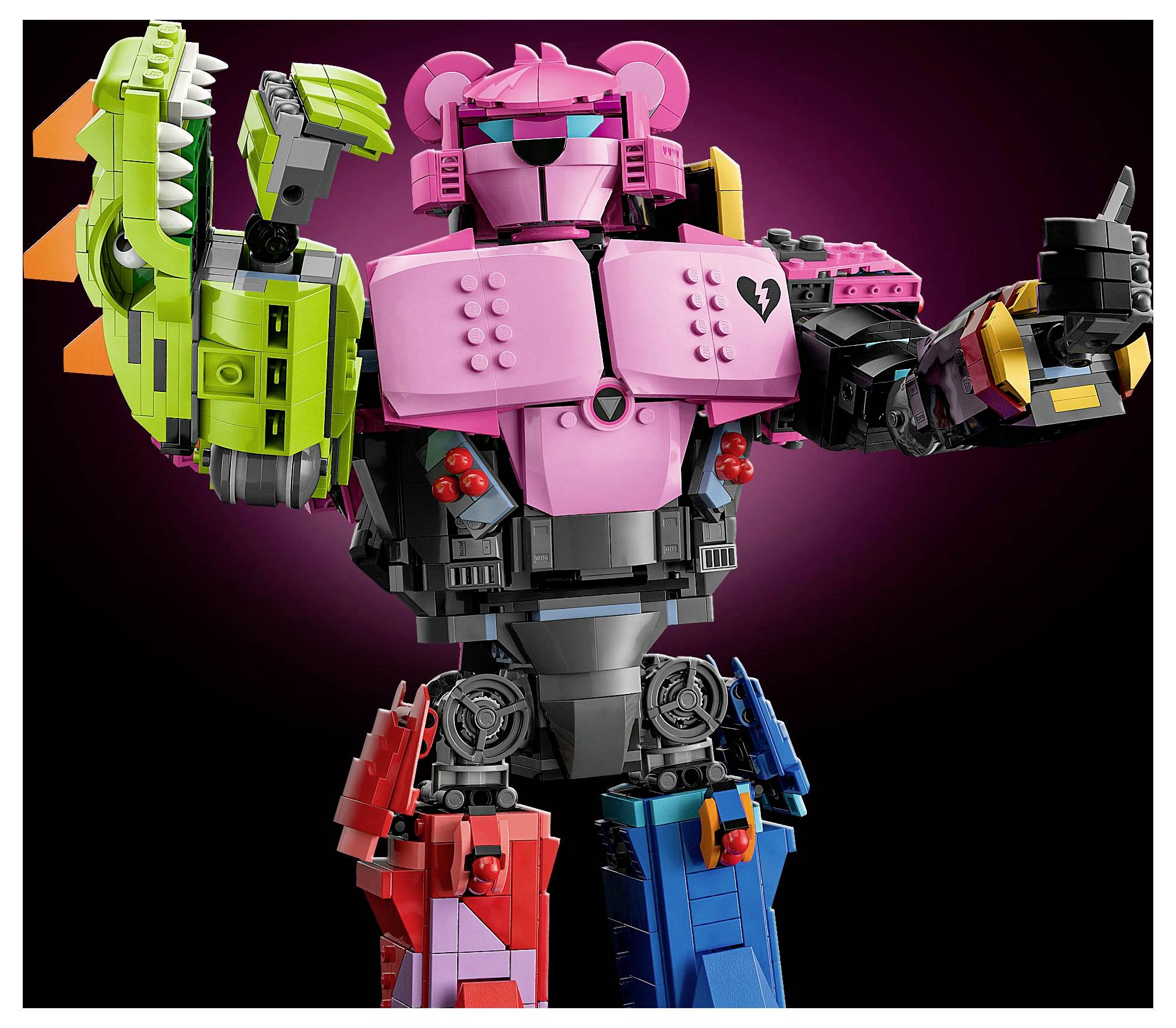 Ein bunter Spielzeugroboter, der aus ineinandergreifenden Bausteinen zusammengesetzt ist, mit einem rosa Kopf, einem grünen Roboterarm und einer Mischung aus roten, blauen und schwarzen Körperteilen.