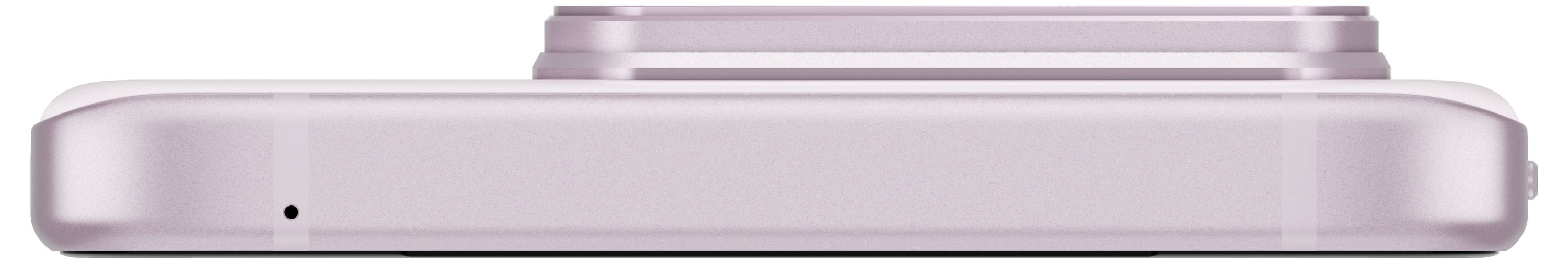 Eine rosa Digitalkamera wird von der Seite gezeigt, fokussiert auf das Objektiv, das sich oben in der Mitte befindet.