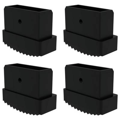 Vier schwarze, rechteckige Plastikobjekte mit gezackter Basis sind in einem quadratischen Muster angeordnet.