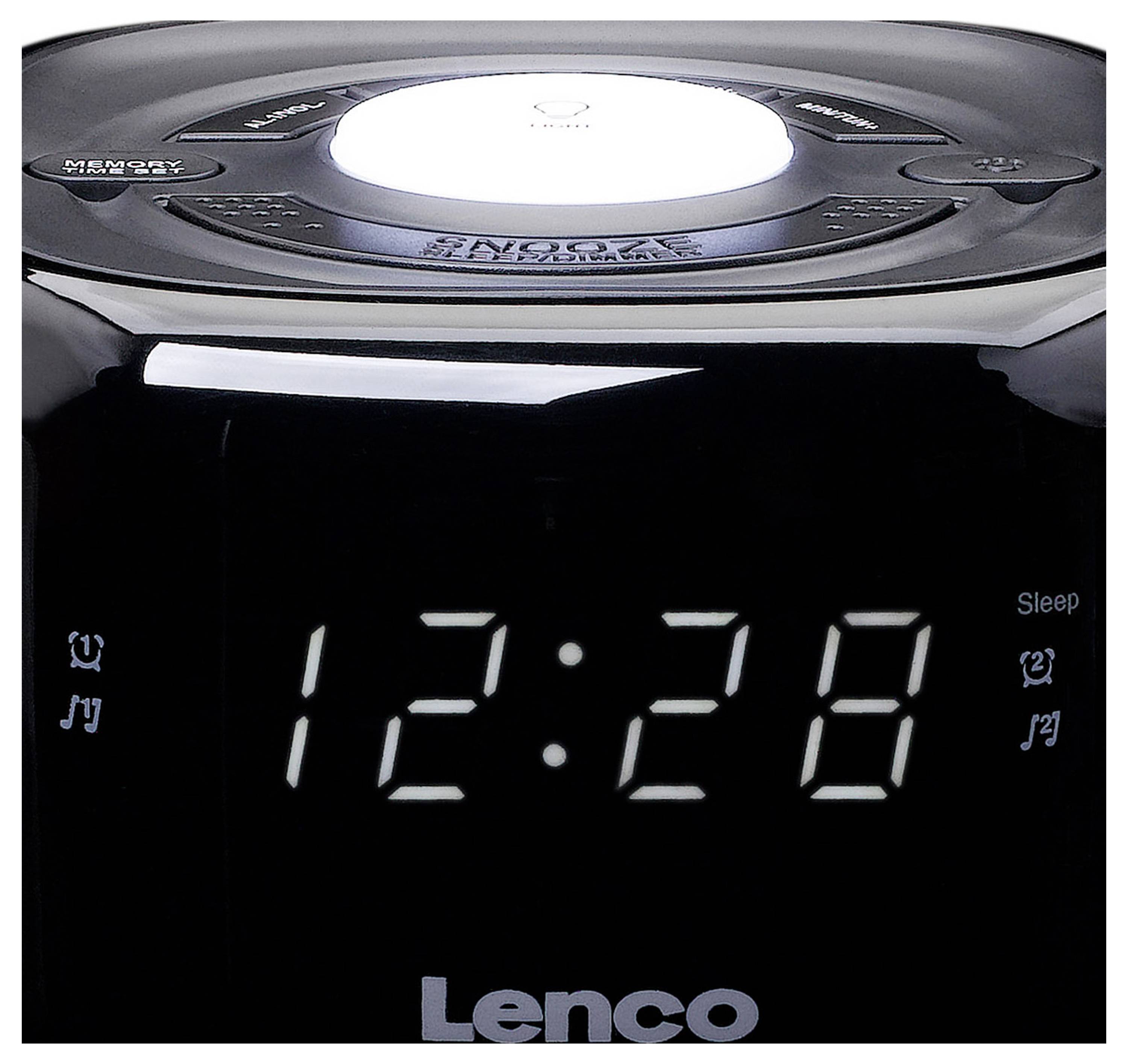 Schwarzer Radiowecker mit digitaler Anzeige zeigt die Uhrzeit 12:28. Oben befindet sich ein Lautstärkeregler.