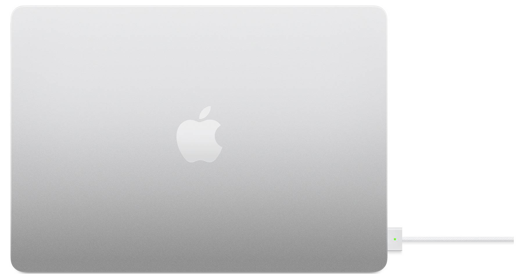 Ein geschlossenes Laptop mit silbernem Gehäuse und einem angebundenen Ladekabel auf der rechten Seite.