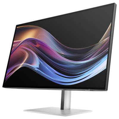 Ein moderner Computermonitor mit schlankem Design zeigt ein farbenfrohes abstraktes Wellenmuster auf dem Bildschirm.
