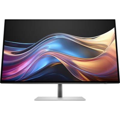 Ein Computermonitor zeigt ein abstraktes, mehrfarbiges Wellenmotiv mit leuchtenden Tönen in Blau, Rosa und Gold.