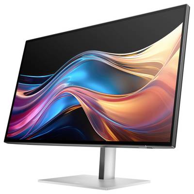 Ein moderner Computerbildschirm mit lebhaftem, wellenförmigem Farbverlauf in Blau und Orange auf dem Display.