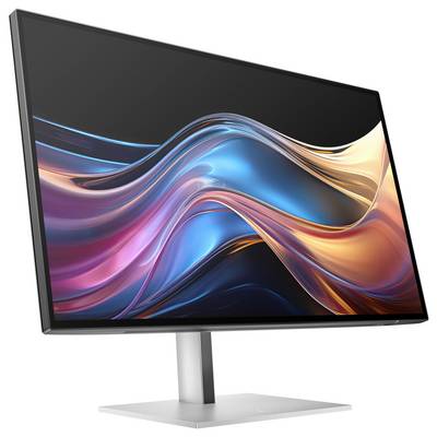Ein moderner Computermonitor auf einem Standfuß zeigt ein abstraktes, wellenförmiges, buntes Design auf dem Bildschirm.