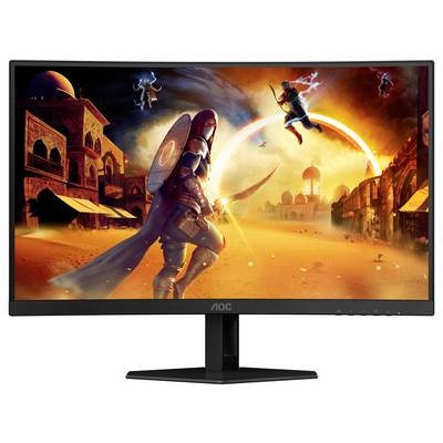 Ein Monitor zeigt ein dynamisches Kampfszenario in einer Wüstenstadt, mit einem Krieger im Vordergrund und leuchtenden Gebäuden im Hintergrund.