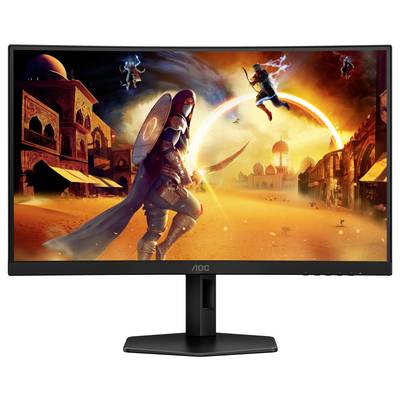Ein Computermonitor zeigt eine Szene aus einem Videospiel mit einem Krieger in einem Wüstendorf, umgeben von Gebäuden und fliegenden Kreaturen.