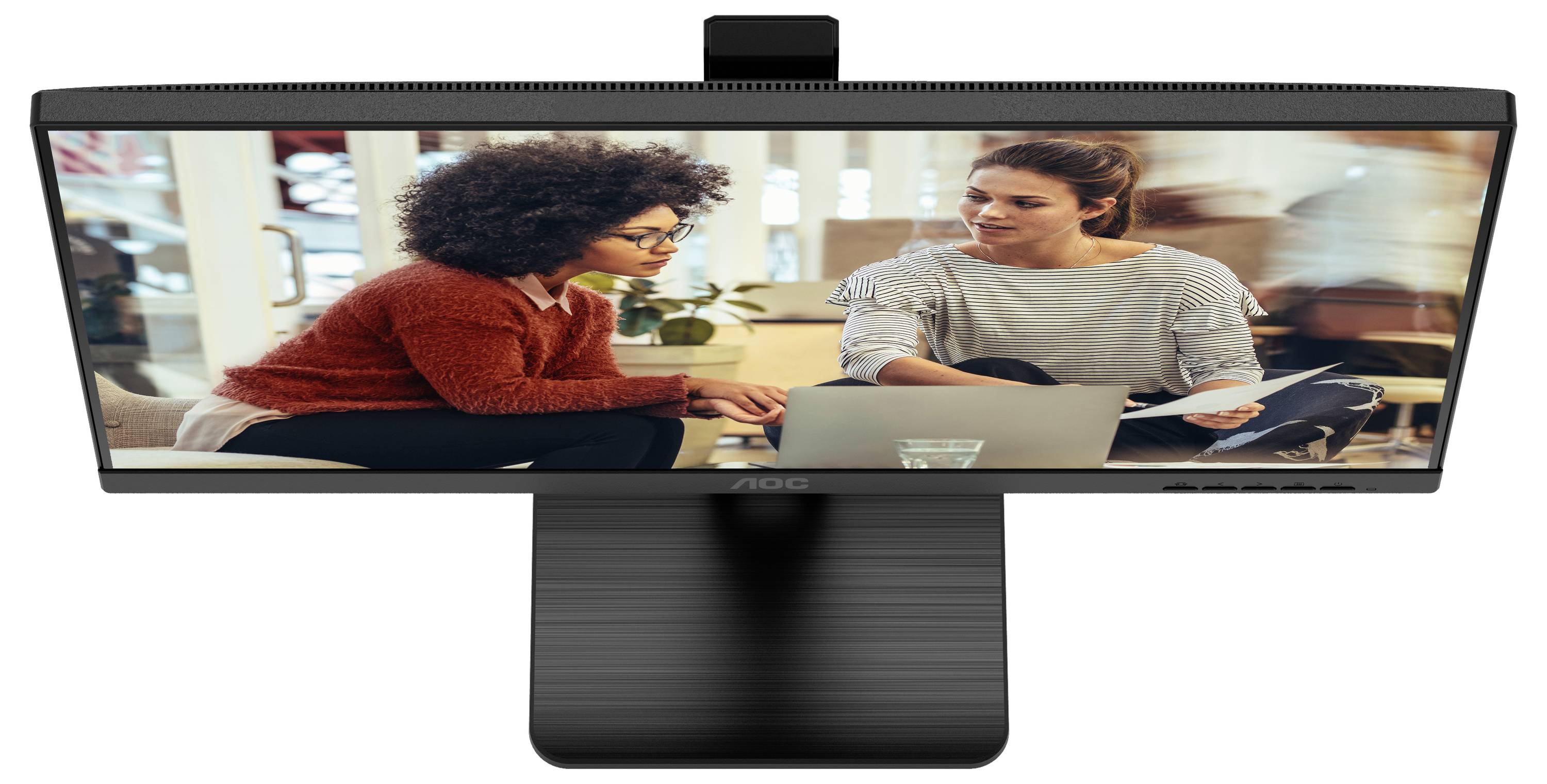 Zwei Personen sitzen an einem Tisch und arbeiten auf einem Laptop. Sie scheinen konzentriert und besprechen wahrscheinlich ein Projekt.