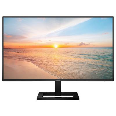 Ein Monitor zeigt ein Bild eines Sonnenuntergangs über einem ruhigen Strand mit wolkenlosem Himmel, vermittelt eine entspannende Atmosphäre.