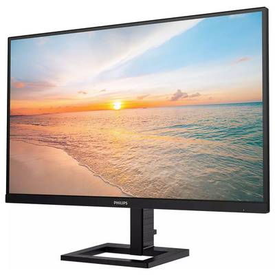 Ein Monitor zeigt eine Landschaft mit einem Sonnenuntergang über dem Meer. Der Himmel ist teils bewölkt und das Wasser ruhig.