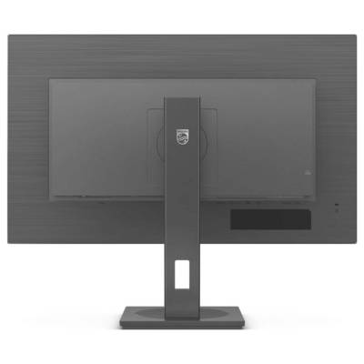 Ein Computerbildschirm von hinten. Der Monitor steht auf einem rechteckigen Standfuß. Das Markenlogo ist auf dem Standfuß sichtbar.
