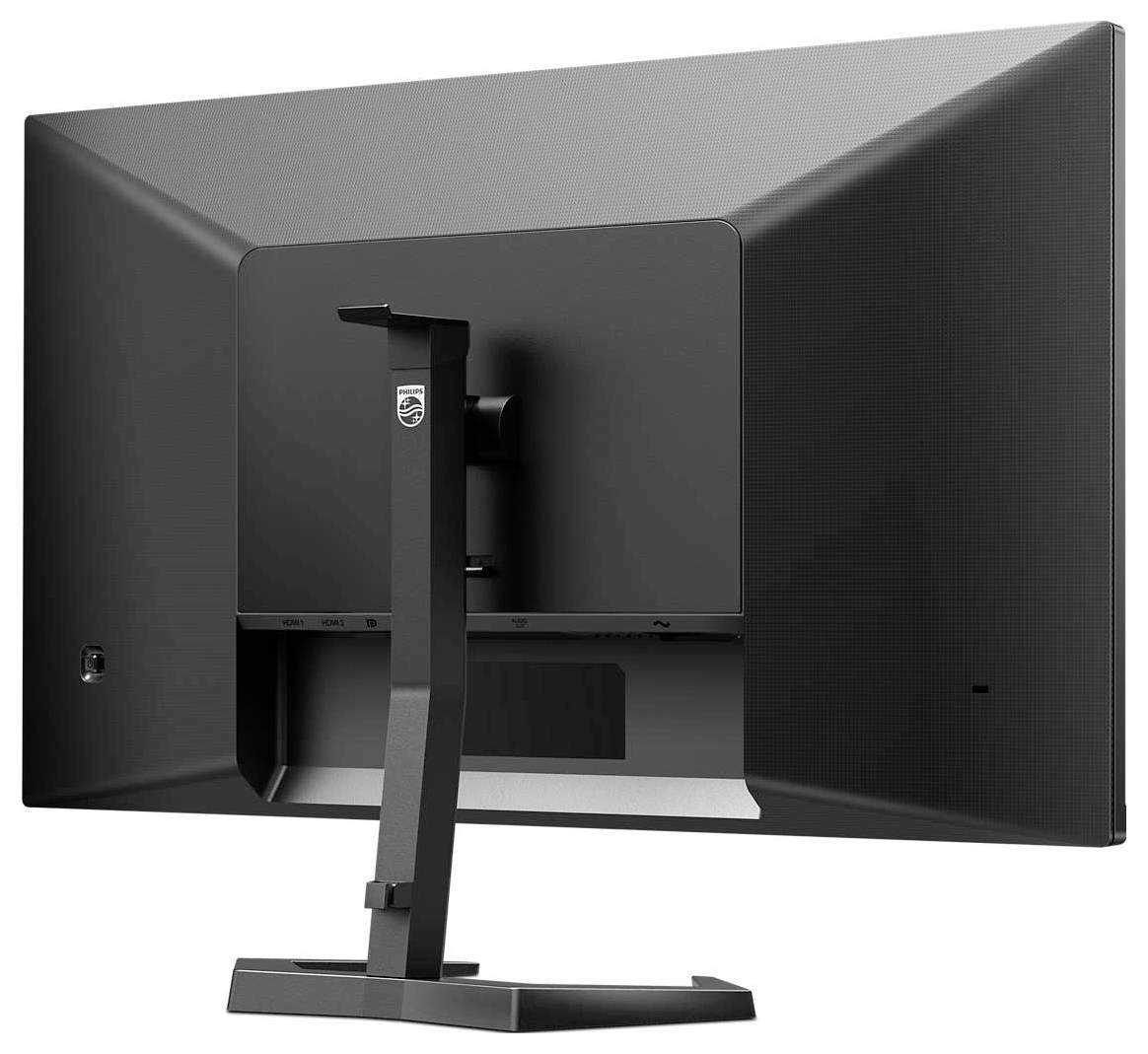 Ein schwarzer Computermonitor von hinten, zeigt den stabilen Standfuß und die matte Oberfläche. Keine Markenkennzeichnung sichtbar.