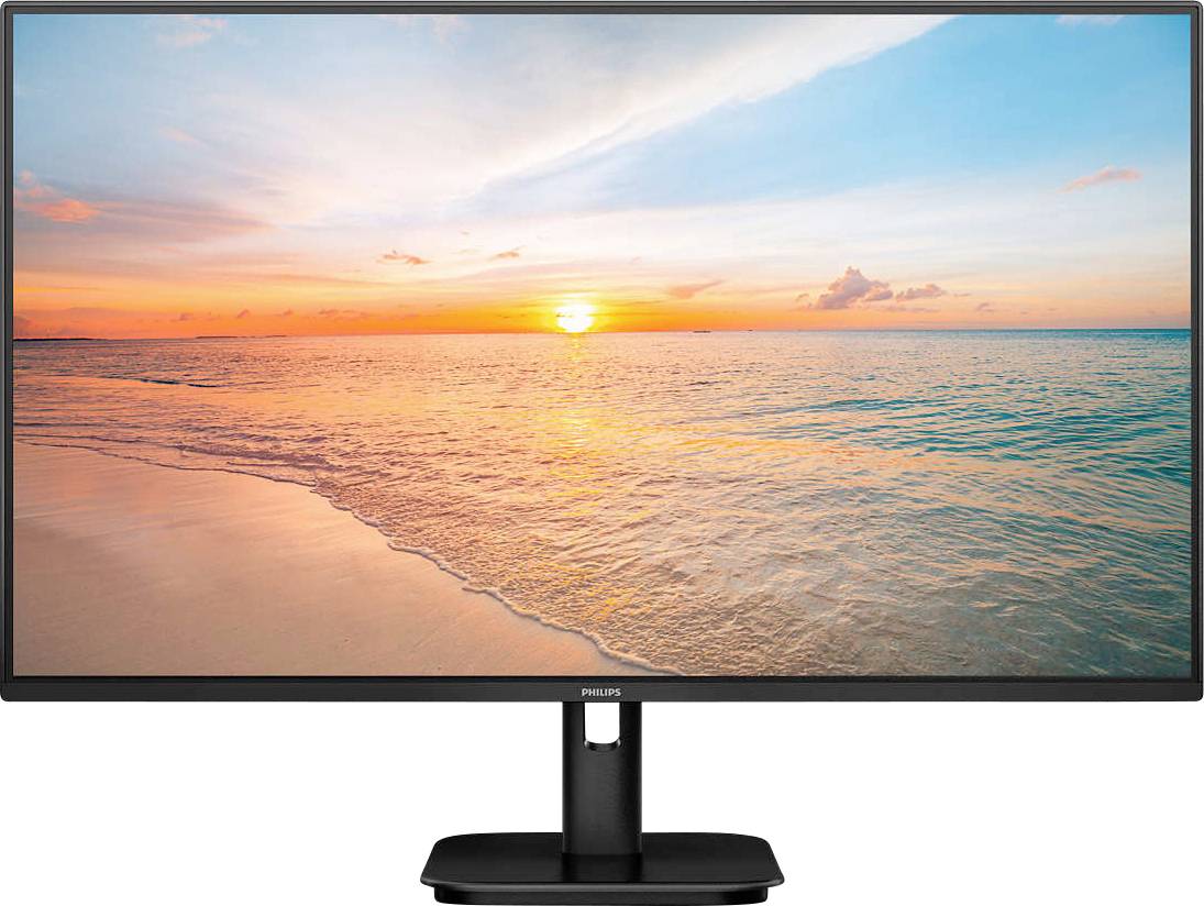 Ein Monitor zeigt ein Sonnenuntergangsstrandbild mit ruhigem Meer und pastellfarbenem Himmel.