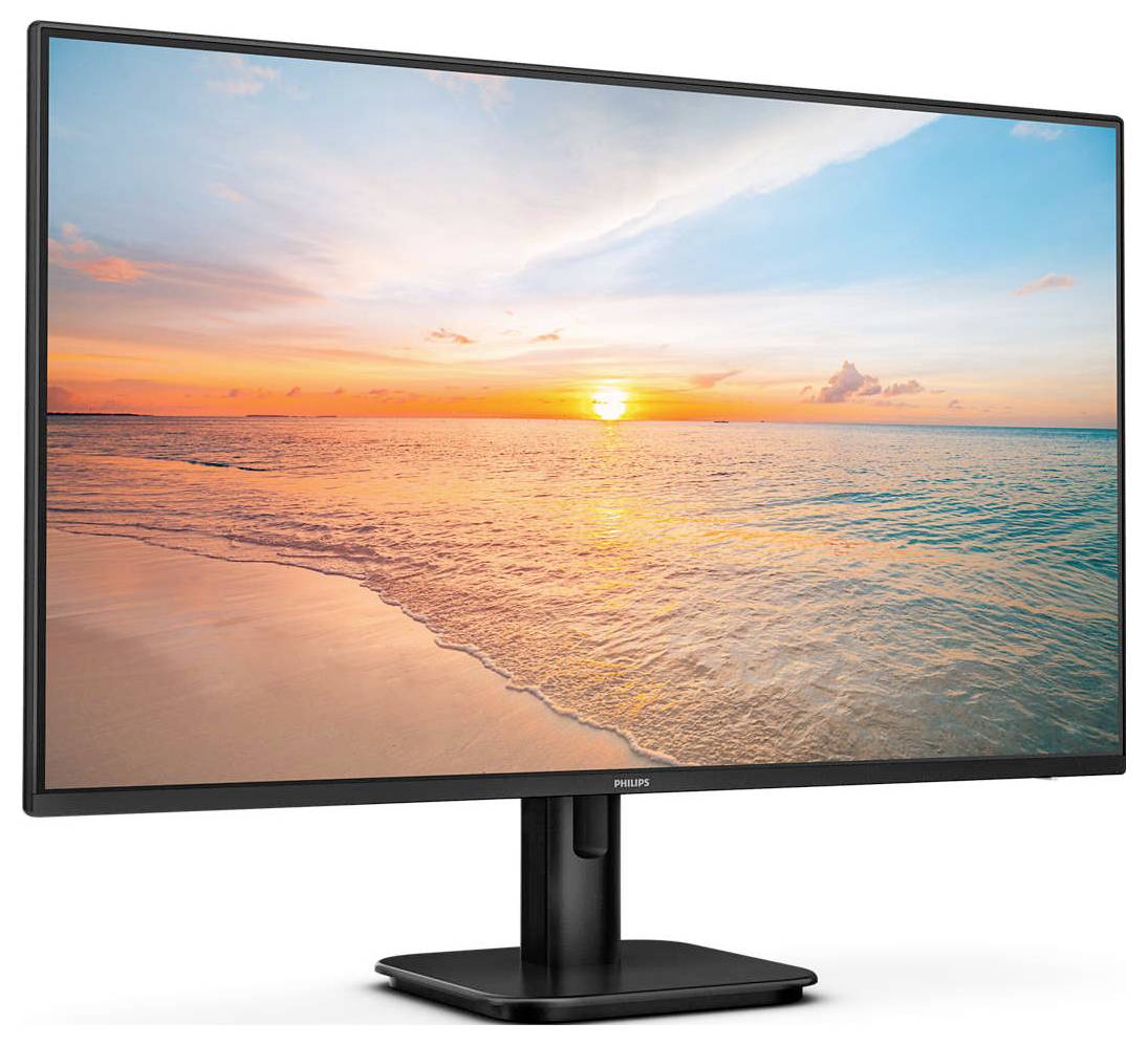 Ein Computerbildschirm zeigt einen Sonnenaufgang über einem ruhigen Meer, der Himmel ist in warmen Tönen von Orange bis Blau gefärbt.