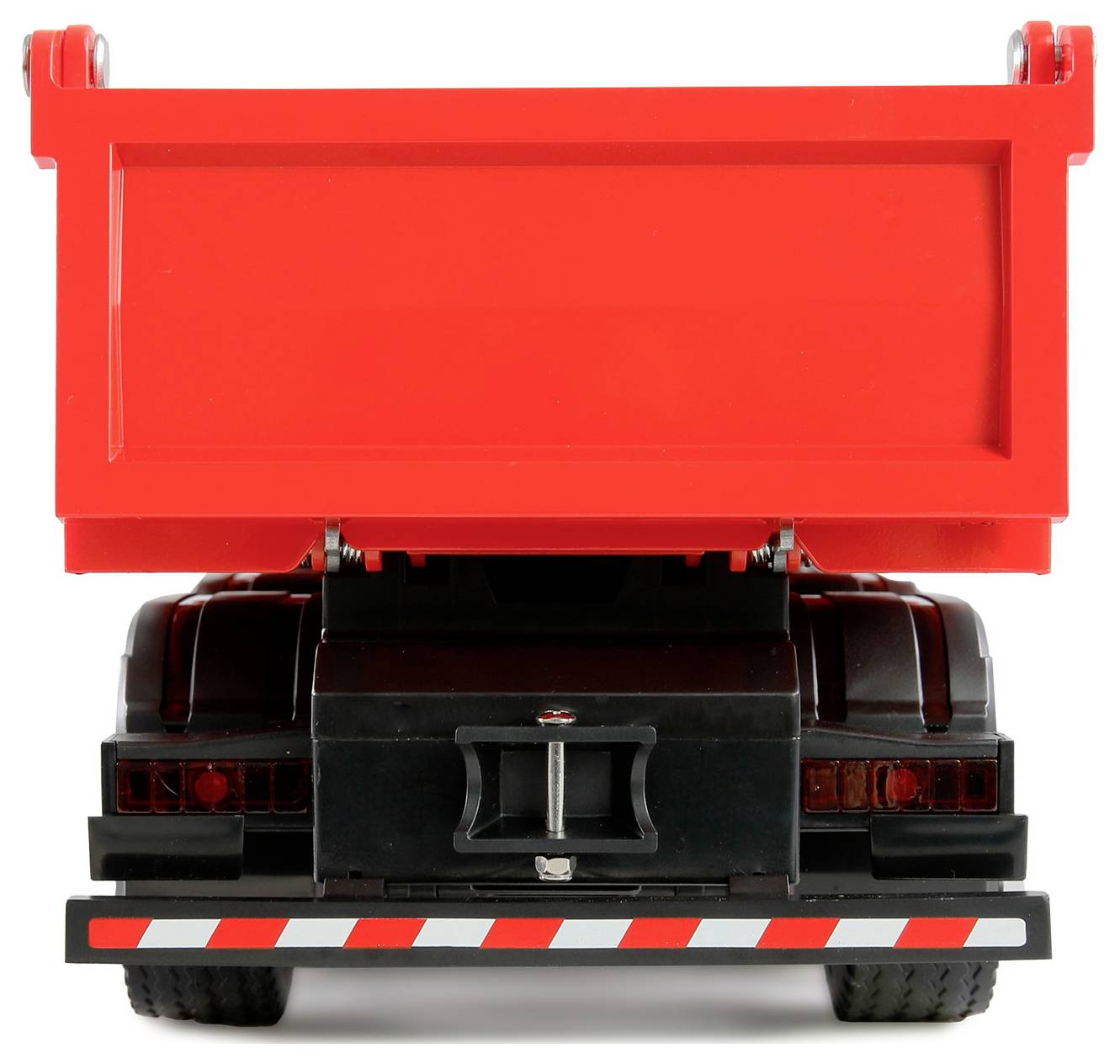 Roter Spielzeug-Muldenkipper mit angehobener Ladefläche, von hinten gesehen.