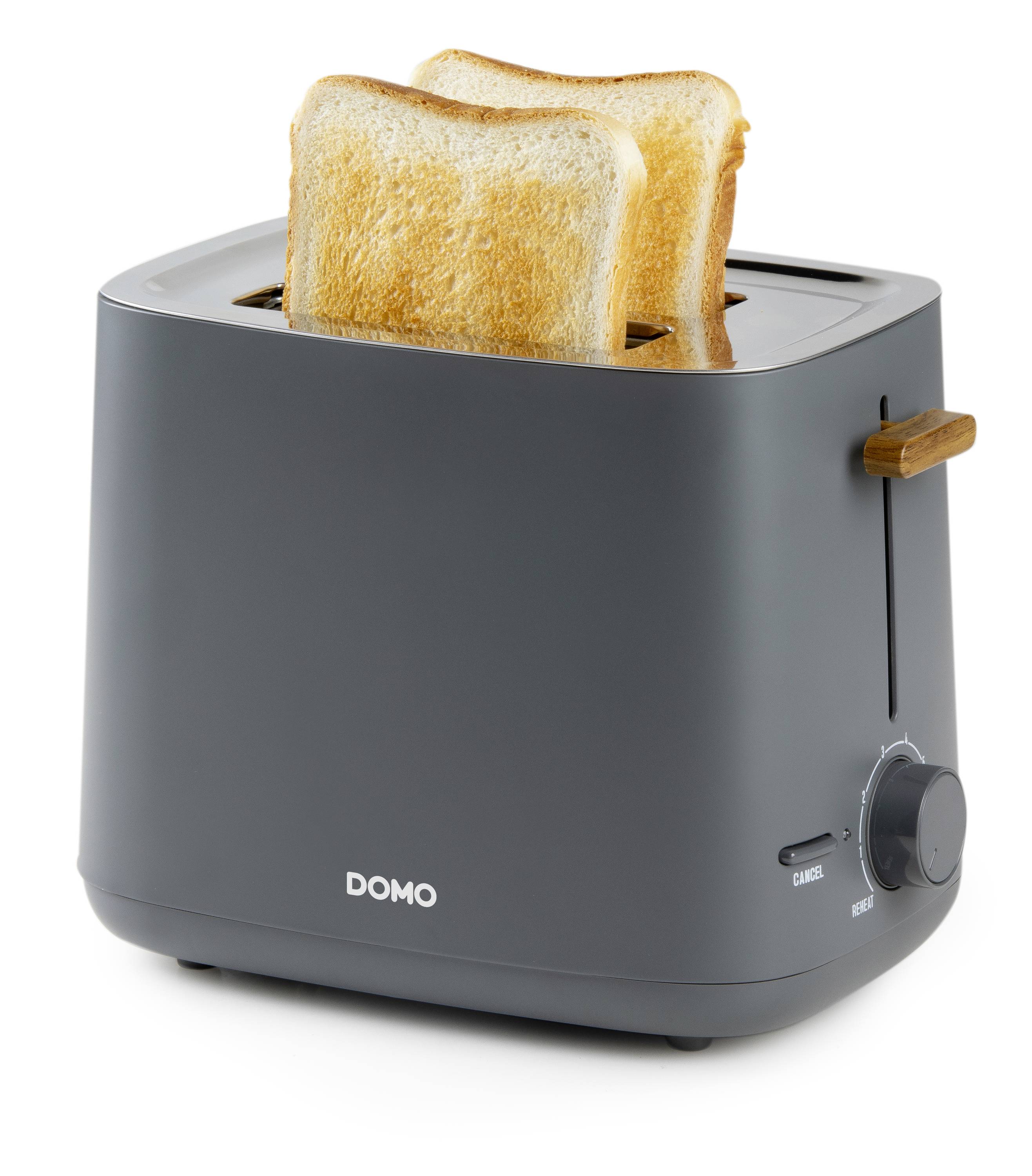 Toaster mit zwei leicht gebräunten Toastscheiben. Dunkelgraues Gerät mit Holzakzenten und Drehknopf an der Seite.