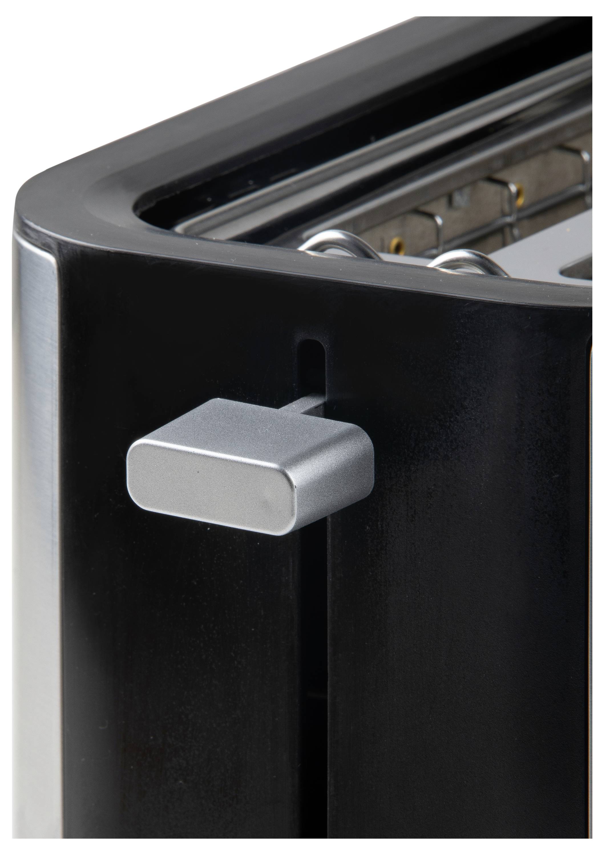 Ein Toaster in Nahaufnahme mit einem silbernen Hebel rechts, der die Toastposition einstellt. Das Innere des Geräts ist teilweise sichtbar.