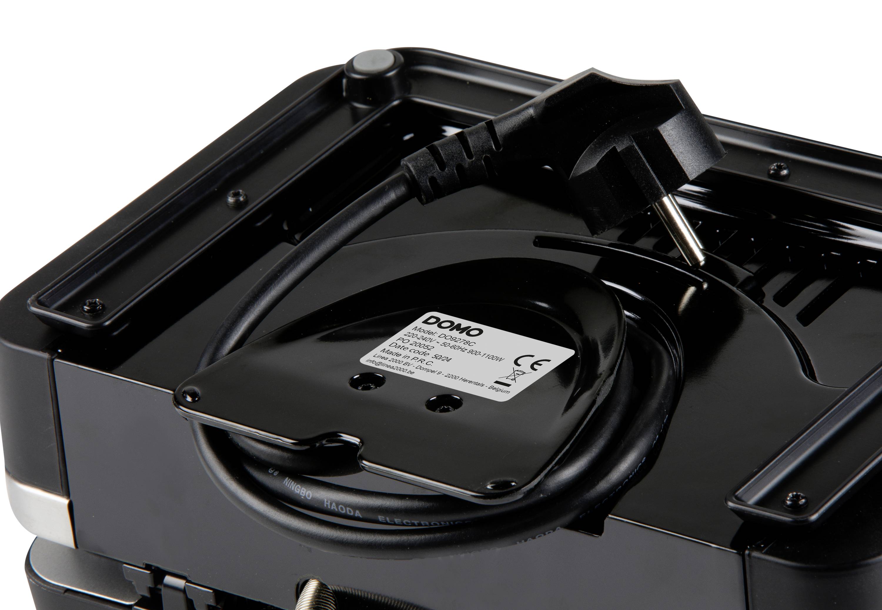 'Schwarzes Elektrogerät mit Kabel und Stecker, auf der Rückseite des Geräts aufgewickelt. Ein Etikett mit technischen Informationen ist sichtbar.'