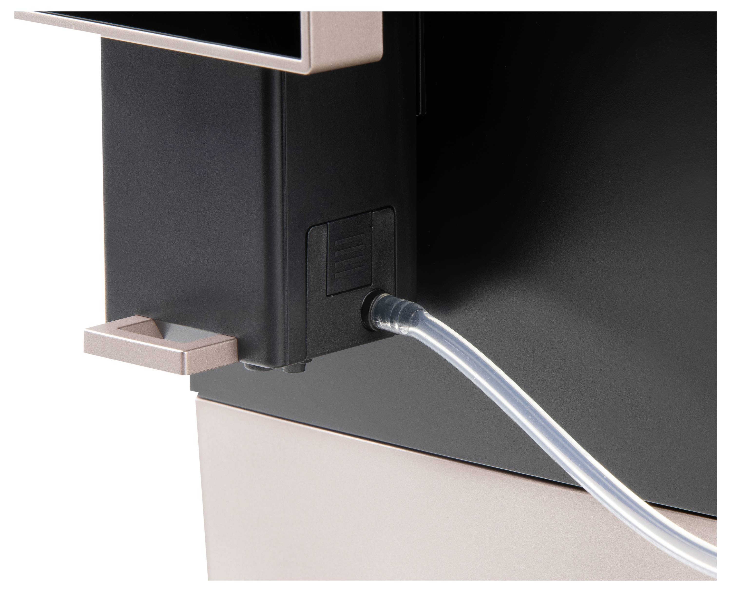 Nahaufnahme eines Geräts mit einem angeschlossenen transparenten Schlauch. Teil einer Maschine, möglicherweise für Flüssigkeitsdurchfluss.