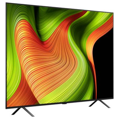 Ein moderner Flachbildschirm-Fernseher mit einem lebhaften abstrakten Design in grünen, orangefarbenen und gelben Tönen, das auf dem Bildschirm dargestellt wird.