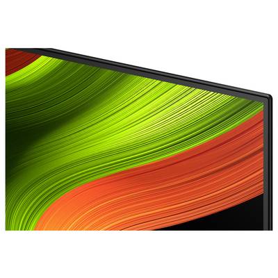 Das Bild zeigt die Ecke eines Computermonitors, auf dem ein lebhaftes grün-orangefarbenes abstraktes Wellenmuster zu sehen ist.