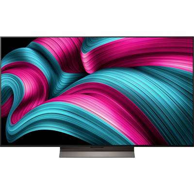 Ein lebhaftes, abstraktes Bild mit dynamischen, geschwungenen Bändern in Petrol und Magenta auf schwarzem Hintergrund, das eine Vorstellung von Bewegung erzeugt.