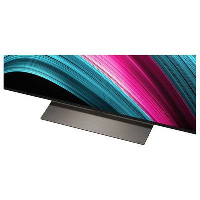 Ein schlanker, ultra-dünner Monitor mit einem lebendigen Wellenmuster aus Türkis- und Magentafarben über den Bildschirm, auf einem minimalistischen Ständer platziert.