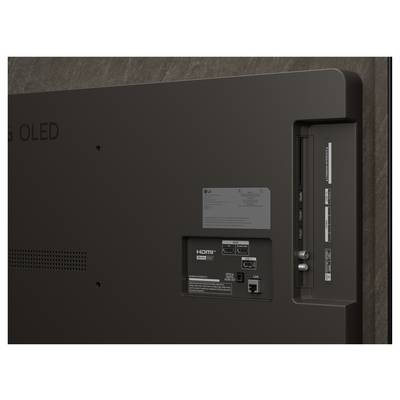 Rückansicht eines Flachbildfernsehers mit verschiedenen Anschlüssen wie HDMI, USB und Antennenanschlüssen an den Seiten- und Rückenpanels.