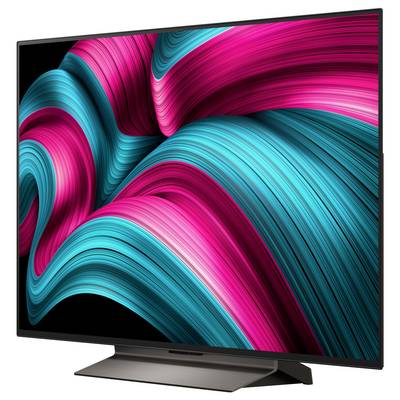 Ein großer Flachbildschirm-Fernseher, der ein lebendiges abstraktes Design mit wirbelnden rosa und türkisfarbenen Linien auf schwarzem Hintergrund zeigt.