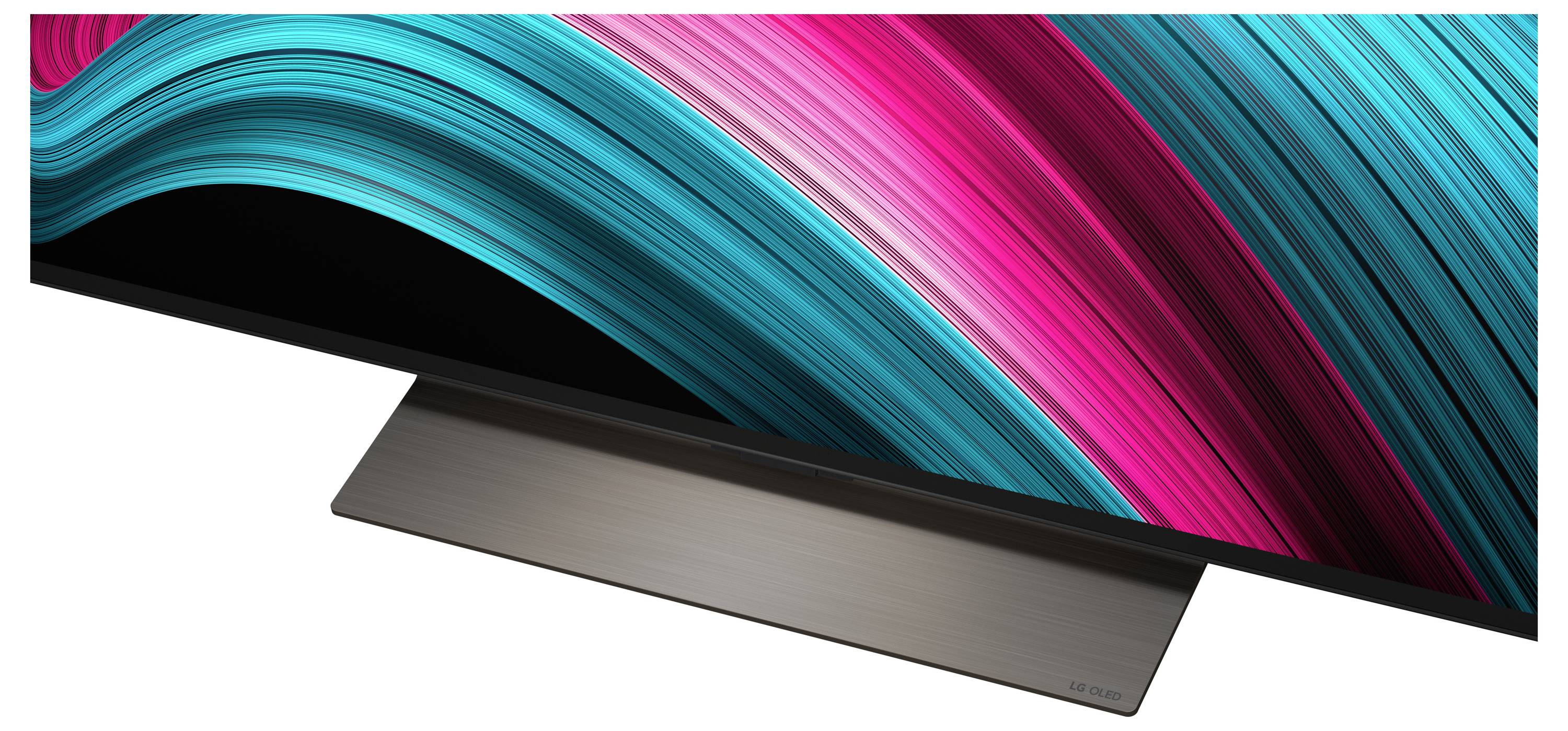 Ein Breitbild-Monitor mit elegantem Design, der dynamische, geschwungene Lichtspuren in leuchtendem Petrol und Pink auf einem schwarzen Bildschirm zeigt.