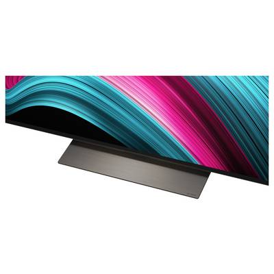 Ein Breitbild-Monitor mit elegantem Design, der dynamische, geschwungene Lichtspuren in leuchtendem Petrol und Pink auf einem schwarzen Bildschirm zeigt.
