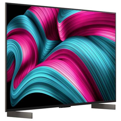 Ein Flachbildfernseher, der auf seinem Bildschirm einen lebhaften, abstrakten Wirbel aus Pink- und Petrolfarben zeigt.