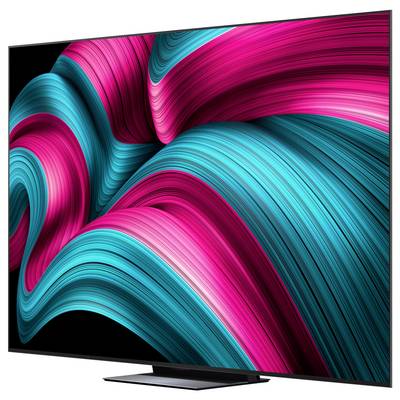 Ein Fernseher mit einem lebhaften abstrakten Design auf dem Bildschirm, das von kräftigen, wirbelnden roten und Petrol-farbenen Linien auf einem schwarzen Hintergrund geprägt ist.