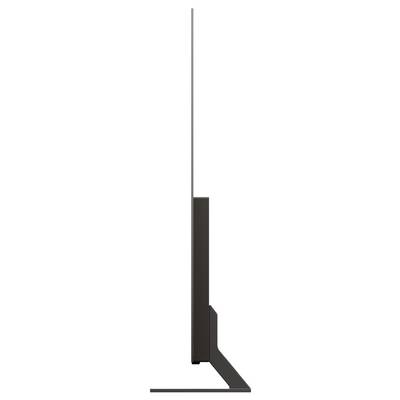 Schmale Seitenansicht eines modernen Flachbildfernsehers auf einem Ständer, der ein minimalistisches und schlankes Design mit einem schmalen Rahmen zeigt.
