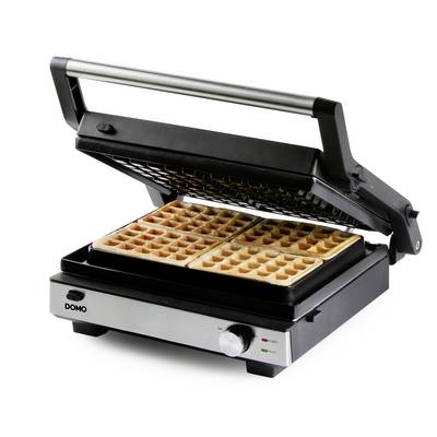 Ein elektrisches Waffeleisen mit geöffneter Klappe zeigt fertige rechteckige Waffeln. Die Anzeigeleuchten sind grün und rot.