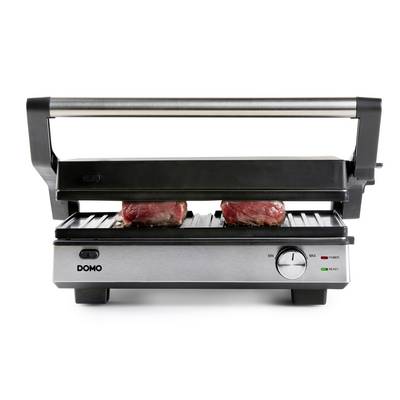 Ein Kontaktgrill mit zwei Stücken rohem Fleisch auf der Grillfläche, unter der geschlossenen oberen Grillplatte.