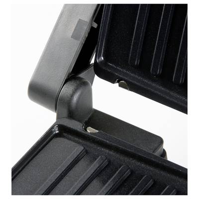 Nahaufnahme eines schwarzen Grills mit gerippten Platten, die geschlossen sind. Geeignet zum Grillen oder Toasten von Lebensmitteln.