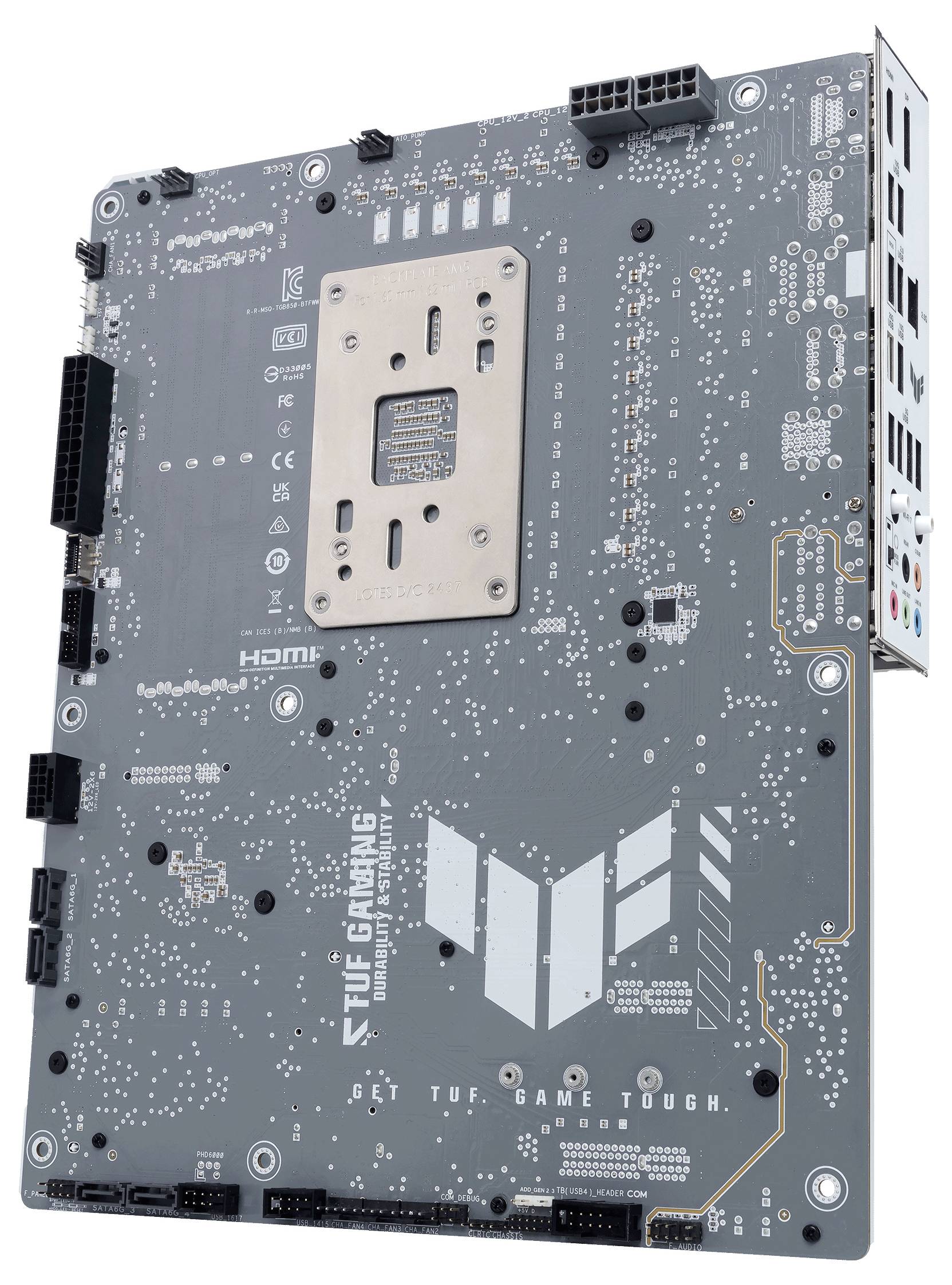 Eine schwarze Computer-Motherboard-Rückseite mit sichtbaren Schaltkreisen und Anschlüssen. Aufschrift: 'TUF GAMING'. Verwendungszweck: Gaming-Hardware.