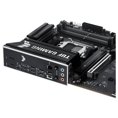 In der Abbildung ist ein schwarzes Mainboard mit mehreren Anschlüssen und einem markanten Schriftzug 'TUF GAMING' zu sehen.