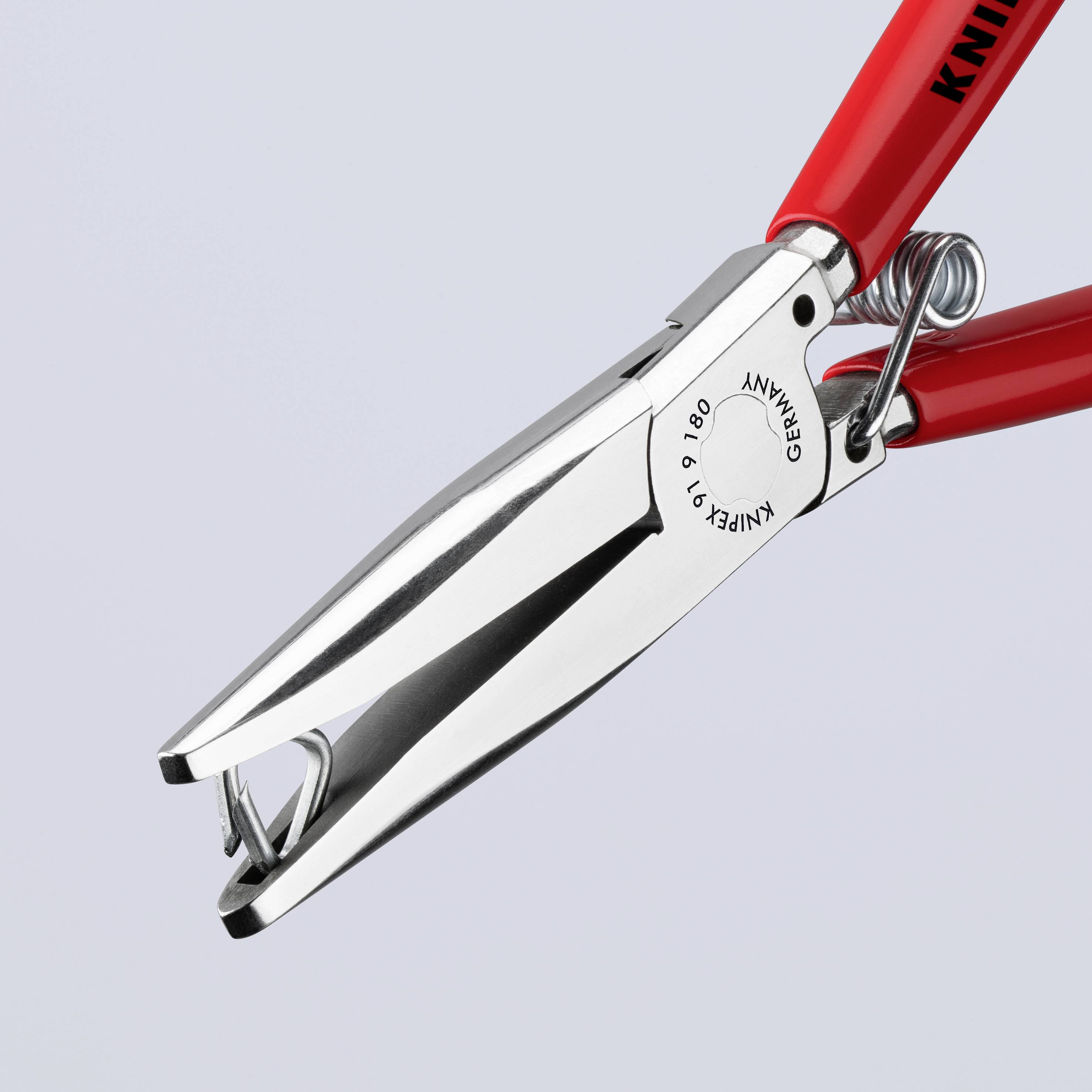 Eine rote Knipex-Abisolierzange mit silbernen Schneiden, ausgelegt zum präzisen Abisolieren von Kabeln.