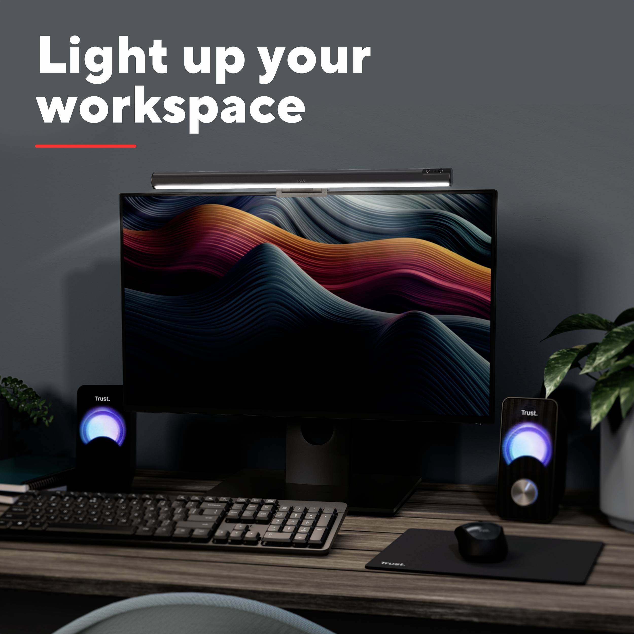 Ein stilvoll beleuchteter Schreibtisch mit einem modernen Monitor, Farbwellen auf dem Bildschirm und dekorativen Lautsprechern.