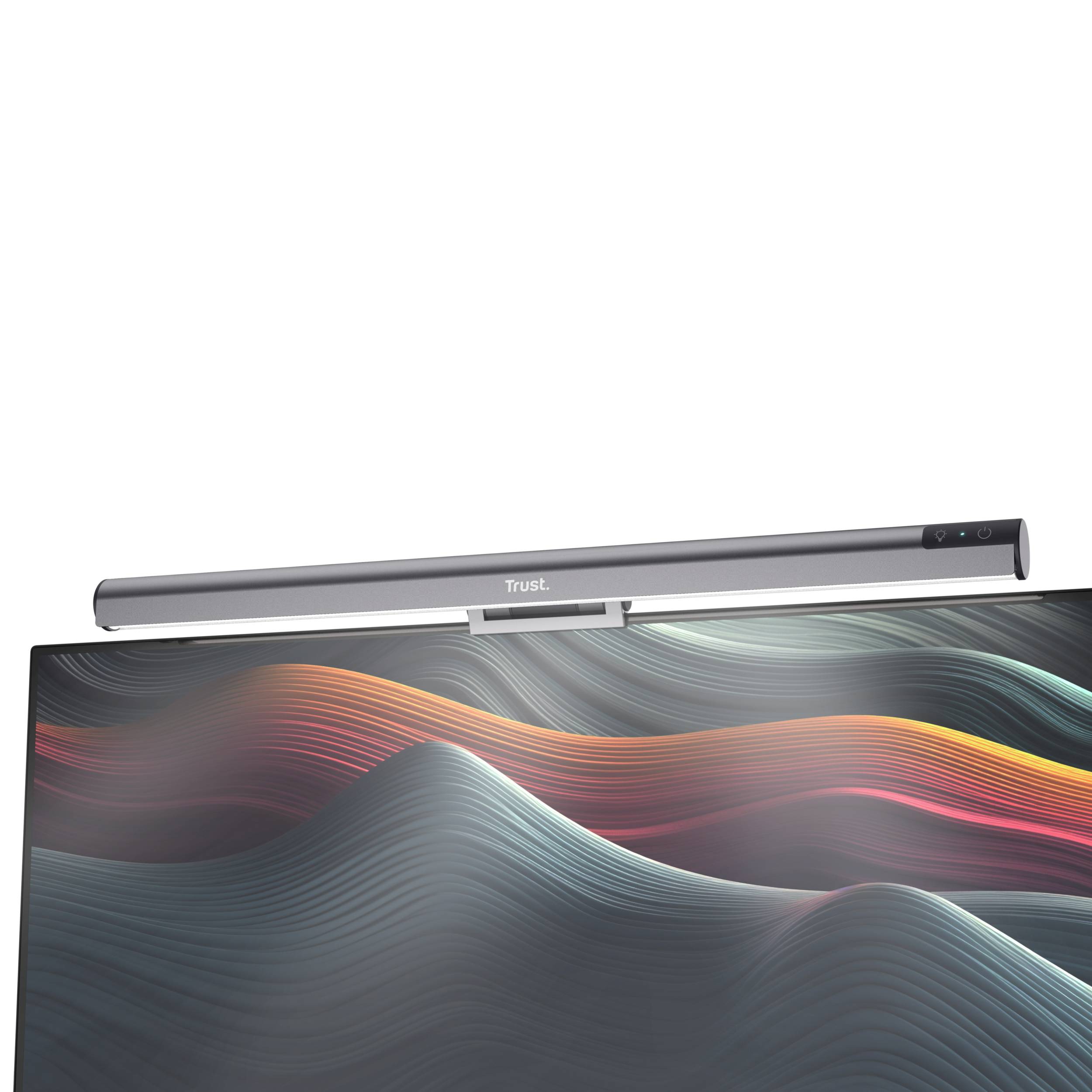 Graue LED-Leuchte von Trust auf einem Monitor, stilisierte Wellen in Rot und Blau als Bildschirmhintergrund.