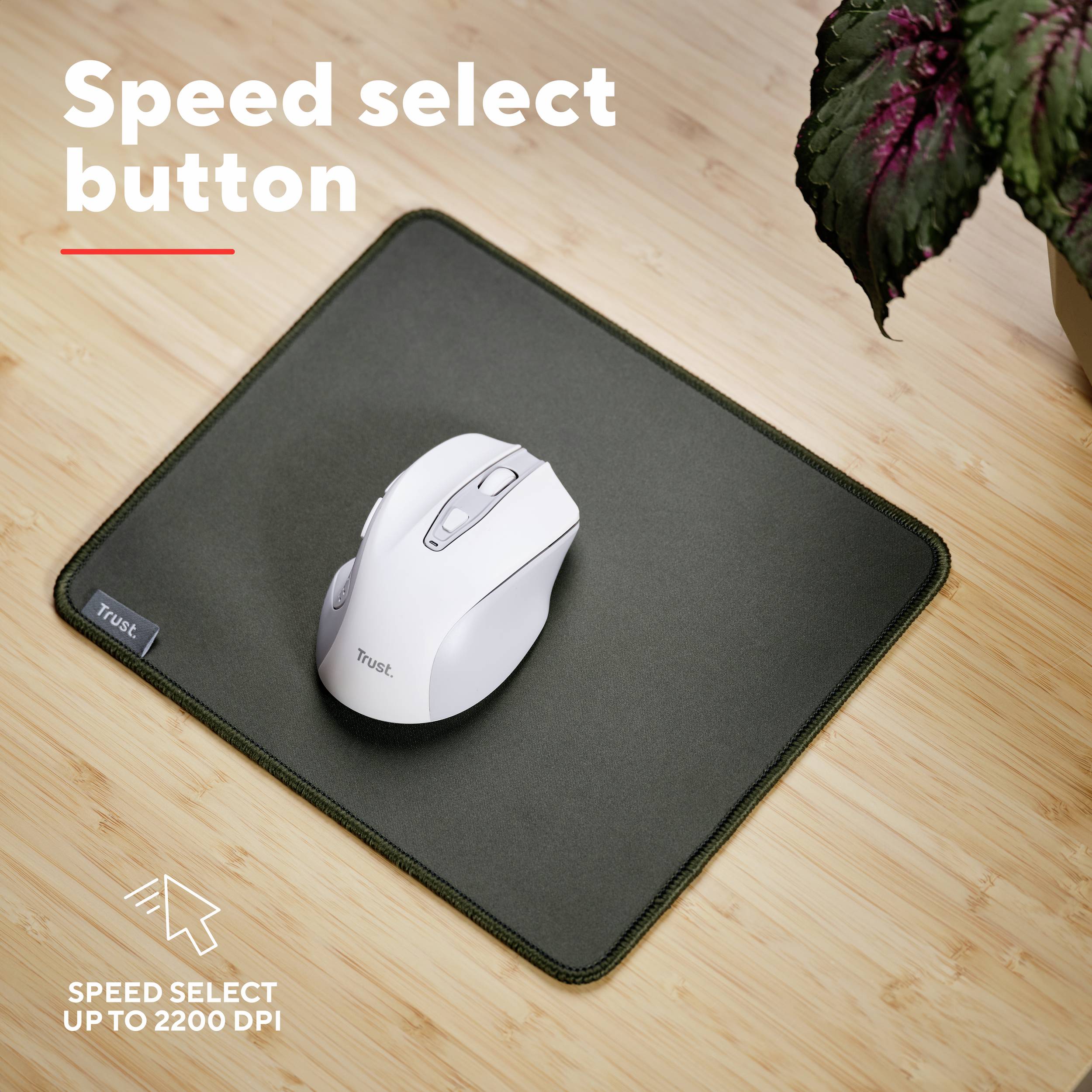 Eine weiße Maus mit 'Speed select button' auf einem dunklen Mauspad. Text: 'Speed select button' und 'Speed select up to 2200 dpi'.