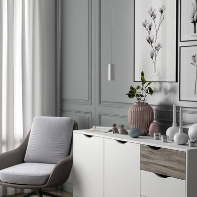 Modernes Wohnzimmer mit grauer Wand, weißem Sideboard, rosa Vase und dekorativen Bildern. Ein grauer Sessel steht links im Bild.
